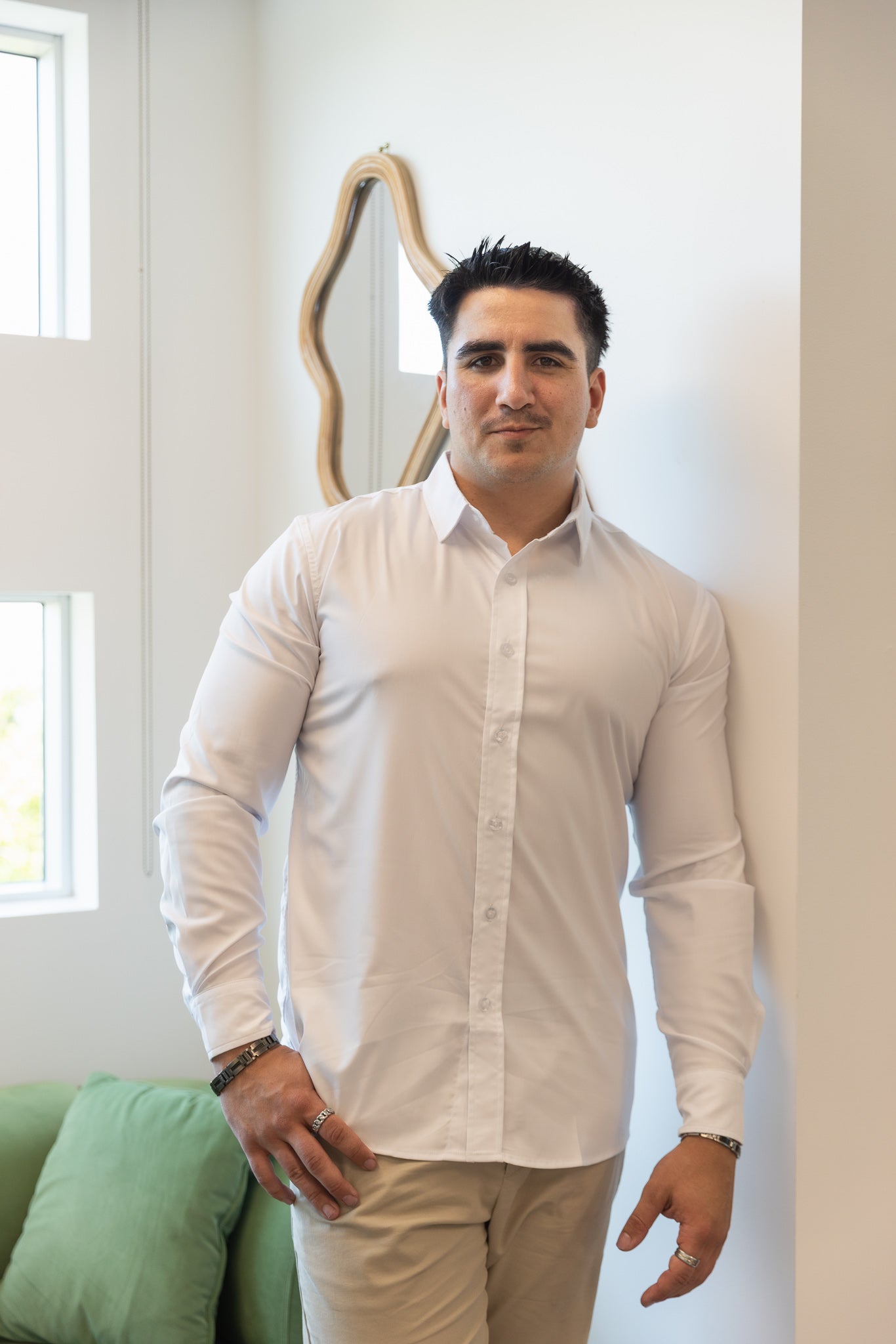 Man wearing a B.Balanced Co white breathable button-up shirt with long sleeves and a crisp collar